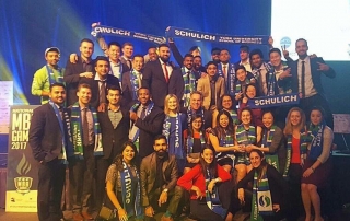 Team Schulich MBA students gathered at the MBA Games, wearing Schulich scarves