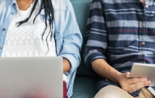 Cropped man and woman using electronic device free image
